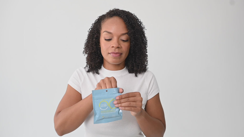 Video showing model eating candy and placing in tote bag for travel ease